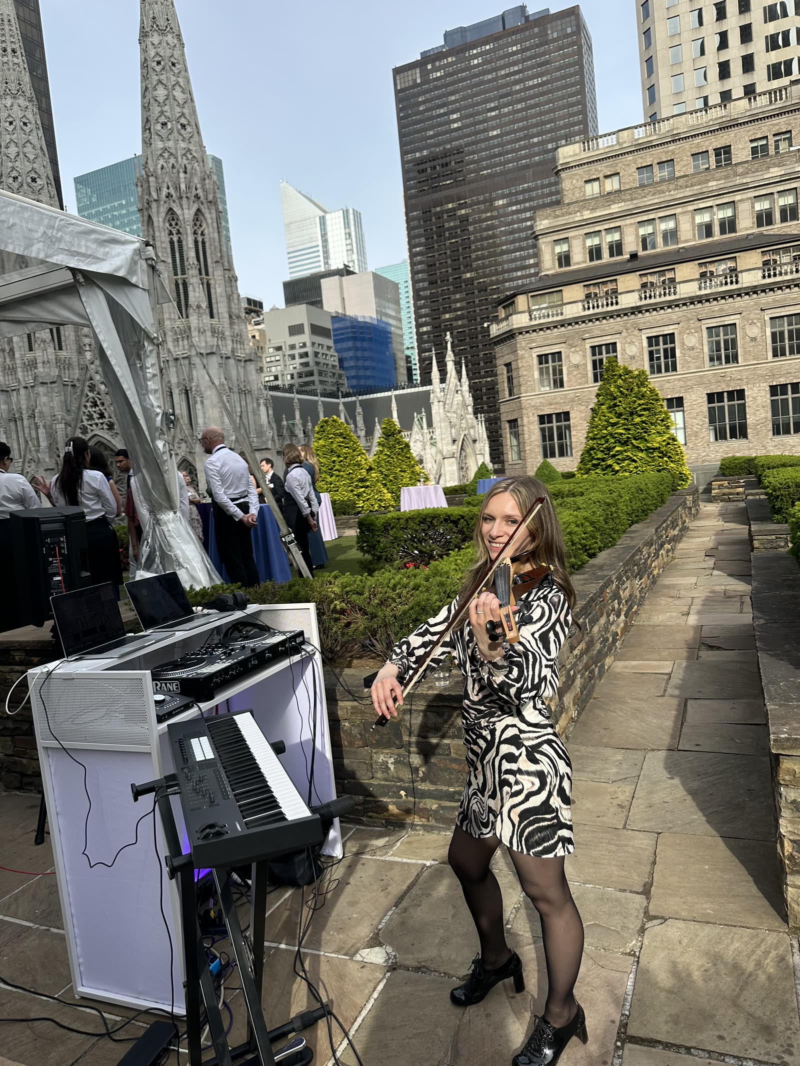 Soul Shades violinist Julie Schatz performing live at the NautaDutilh rooftop reception, 620 Loft & Garden, NYC