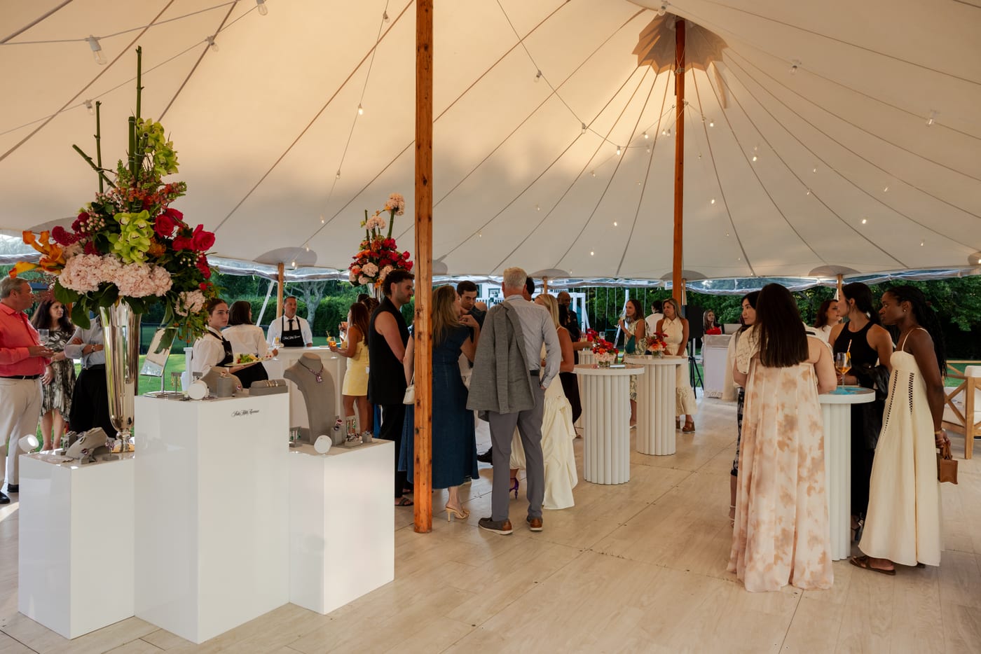 Jared Lehr jewelry showcase and guests at a Saks Fifth Avenue private estate event in Water Mill, New York