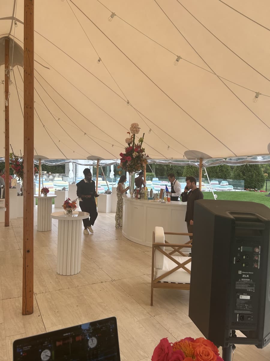 Cocktail lounge and bar setup at a Saks Fifth Avenue private estate event in Water Mill, New York