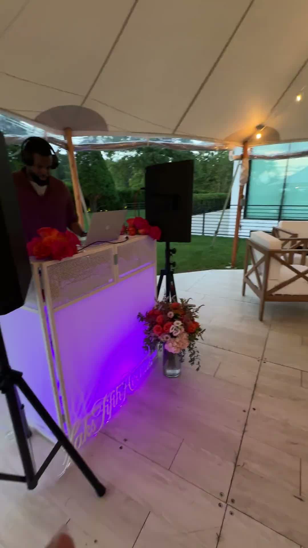 DJ DX djing under a sailcloth tent at a Saks Fifth Avenue private estate event in Water Mill, New York, second clip